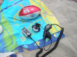 Charging cell phone at the beach with Solar Energy from EL8 Headlamp